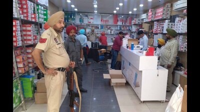 The raid being conducted by the state GST department at the shop in Kochar Market on Monday. (HT Photo) The raid being conducted by the state GST department at the shop in Kochar Market on Monday. (HT Photo)