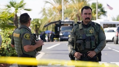 Orange County Sheriff's deputies guard the parking lot of Geneva Presbyterian Church in Laguna Woods, California after a fatal shooting. (AP) Orange County Sheriff's deputies guard the parking lot of Geneva Presbyterian Church in Laguna Woods, California after a fatal shooting. (AP)