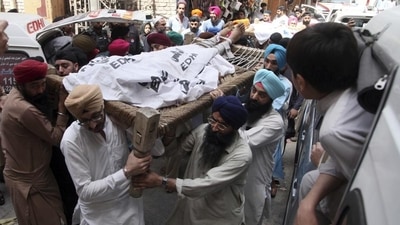 Pakistani Sikhs carry the body of a Sikh who was killed by gunmen in Peshawar, Pakistan, Sunday. (AP) Pakistani Sikhs carry the body of a Sikh who was killed by gunmen in Peshawar, Pakistan, Sunday. (AP)