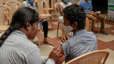 A health worker inoculates a school student with a dose of ‘Corbevax’ vaccine during a vaccination drive at a school in Bangalore. (AFP) A health worker inoculates a school student with a dose of ‘Corbevax’ vaccine during a vaccination drive at a school in Bangalore. (AFP)