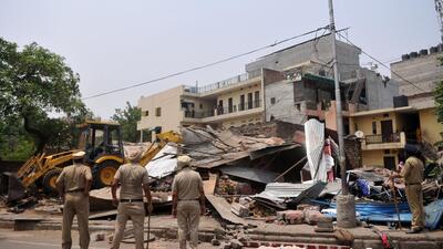Policemen standing guard as a JCB machine brings down illegal shops at Shaheed Bhagat Singh Market in Phase 1, Mohali. (Ravi Kumar/HT) Policemen standing guard as a JCB machine brings down illegal shops at Shaheed Bhagat Singh Market in Phase 1, Mohali. (Ravi Kumar/HT)