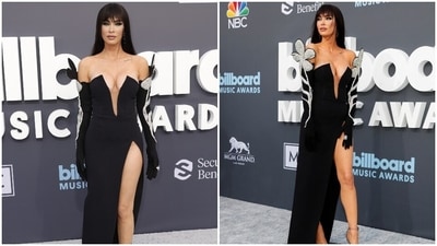 Megan's gown featured a risqué thigh-high slit, built-in gloves and rhinestone flowers attached to the shoulders. She teamed her breathtaking ensemble with killer high heels, bold eye makeup, nude lips and a glowing face. However, the highlight of her look was the bangs she debuted on the 'grey carpet'. (AFP, Reuters) Megan's gown featured a risqué thigh-high slit, built-in gloves and rhinestone flowers attached to the shoulders. She teamed her breathtaking ensemble with killer high heels, bold eye makeup, nude lips and a glowing face. However, the highlight of her look was the bangs she debuted on the 'grey carpet'. (AFP, Reuters)