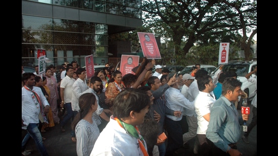 NCP party workers protest over fuel price hike in front of a venue attended by Union minister Smriti Irani at SB road on Monday. (HT PHOTO)