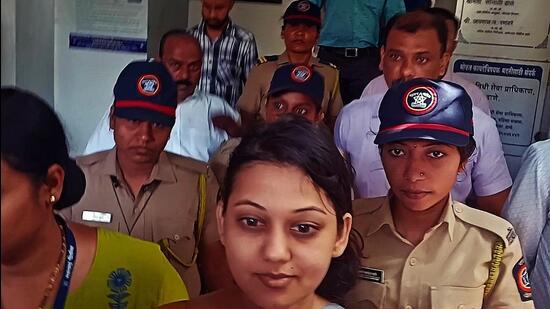 Thane crime branch officials take Marathi actor Ketaki Chitale to her house in Navi Mumbai on Monday. Praful Gangurde/HT Photo
