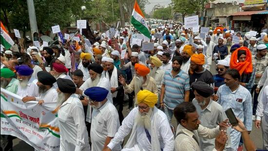 Ambala residents carrying out a massive protest march against MLA Aseem Goyal weeks after his controversial ‘Hindu Rashtra’ oath. (HT Photo)