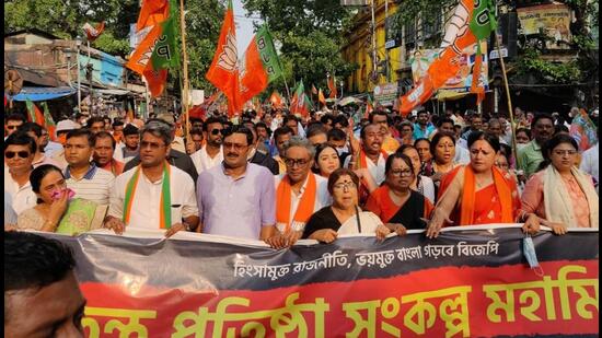 The West Bengal BJP held a march in Kolkata earlier this month to mark the first anniversary of post-poll violence against BJP workers such as Abhijit Sarkar (Twitter/swapan55)