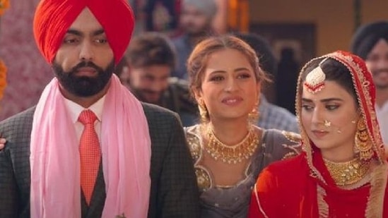 Ammy Virk, Nimrat Khaira, and Sargun Mehta in a still from Saunkan Saunkne.