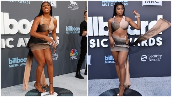 Megan Thee Stallion slipped into an ombre hued mini dress to attend the Billboard Music Awards 2022. The rapper's dress came in black, cream, beige and brown shades mixed together and featured rhinestone embellishments, cut-outs, a floor-grazing train and a wrapover silhouette. Centre-parted tresses, glam nails, bold makeup matching the dress and chunky jewellery rounded it all off.(Reuters, AP)