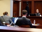 Amber Heard testifies in the courtroom while Johnny Depp (left) listens. (AP)(AP) Amber Heard testifies in the courtroom while Johnny Depp (left) listens. (AP)(AP)