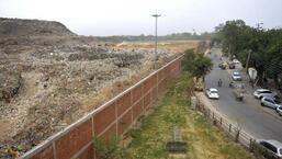 Chandigarh MC commissioner informed the court that a 1,200-metre-long and 4.5-metre-high wall had been constructed to prevent leachate from Dadumajra landfil leaking into nearby houses. (Keshav Singh/HT)