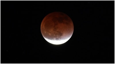 The moon is referred to as the blood moon due to the reddish colour. It is because of the red wavelengths of the sun filtering through the earth’s atmosphere. (AFP)