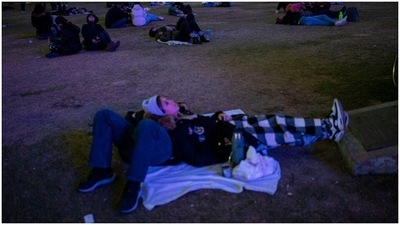 In Argentina, people gathered around the planetarium to watch the blood moon together. (AP Photo)