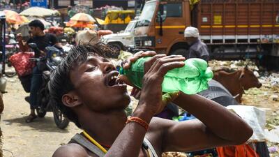 A man drinks water to quench his thirst on a hot summer day, in New Delhi, on Tuesday. (PTI) A man drinks water to quench his thirst on a hot summer day, in New Delhi, on Tuesday. (PTI)