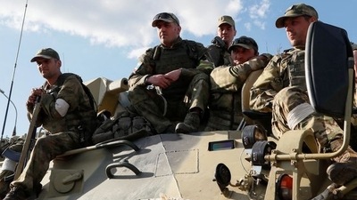 &nbsp;Service members of pro-Russian troops wait atop an armoured personnel carrier before the expected evacuation of wounded Ukrainian soldiers from the besieged Azovstal steel mill in the course of Ukraine-Russia conflict in Mariupol,&nbsp; (REUTERS)