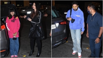 On Tuesday, paparazzi captured Aishwarya along with Aaradhya and Abhishek, arriving at the Mumbai airport to catch an early morning flight out of the bay. The family arrived together at the airport and even posed for the shutterbugs. Additionally, Aishwarya was seen walking with her hand around Aaradhya's shoulder and posing with fans. (HT Photo/Varinder Chawla)