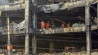 NDRF personnel clear the charred debris from a burnt floor a day after a fire broke out in a commercial building at Mundka, New Delhi. (HT PHOTO.) NDRF personnel clear the charred debris from a burnt floor a day after a fire broke out in a commercial building at Mundka, New Delhi. (HT PHOTO.)