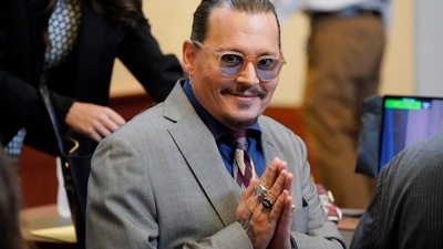 Johnny Depp arrives into the courtroom at the Fairfax County Circuit Courthouse in Fairfax. (AP) Johnny Depp arrives into the courtroom at the Fairfax County Circuit Courthouse in Fairfax. (AP)