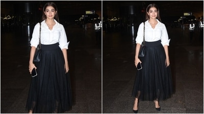 In the end, Pooja rounded off the ensemble with minimal styling, including nude lip shade, winged eyeliner, glowing skin, blushed cheeks, centre-parted open tresses, a chained shoulder bag and pointed black high heels. (HT Photo/Varinder Chawla)