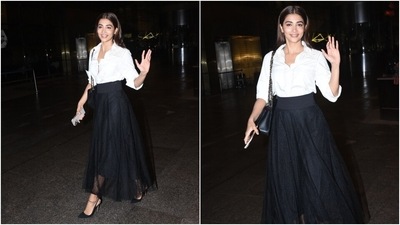 Meanwhile, Pooja Hegde looked her elegant best at the Mumbai airport. Paparazzi clicked the actor arriving in a monochrome ensemble to catch her flight. She scored full marks on the chic airport fashion, and you should definitely take notes from her. (HT Photo/Varinder Chawla)
