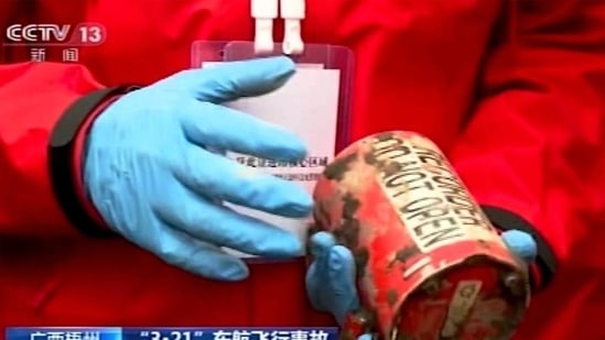 A search and rescue worker holds the second orange-coloured ‘black box’ recorder recovered from the China Eastern flight crash site in Tengxian County, in southern China’s Guangxi Zhuang Autonomous Region. (AP) A search and rescue worker holds the second orange-coloured ‘black box’ recorder recovered from the China Eastern flight crash site in Tengxian County, in southern China’s Guangxi Zhuang Autonomous Region. (AP)