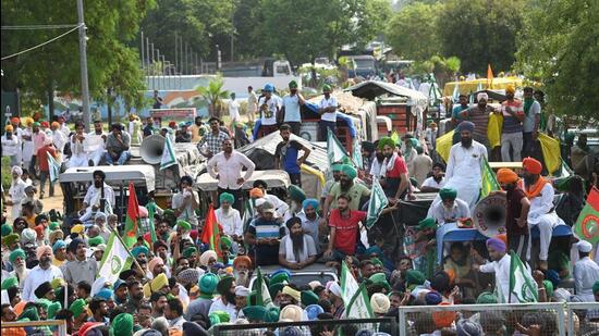 Farmers protest near Chandigarh-Mohali border after being stopped from heading towards Chandigarh, in Mohali on Tuesday. (PTI)