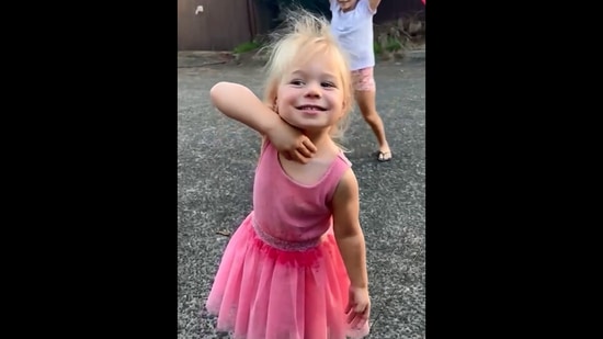 The image, taken from the video posted on Instagram by David Warner, shows his daughter re-enacting the ‘Jhukega Nahi’ step from Allu Arjun’s Pushpa.(Instagram/@davidwarner31)