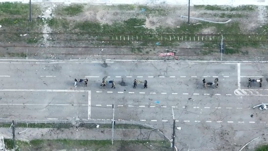 Drone footage shows people being carried on stretchers from the Azovstal steelworks plant, during Russia's and pro-Russian troops' attack on the city of Mariupol.(VIA REUTERS)