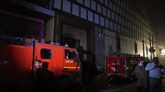 Firefighters during a search operation at Atlantis Banquet hall at GT Karnal Road in Delhi on Tuesday.(Raj K Raj/ HT Photo)