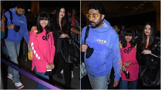 Abhishek and Aaradhya opted for casual airport looks. While the actor wore a blue sweatshirt teamed with denim jeans, quirky yellow sunglasses and sneakers, his daughter slipped into a pink printed oversized sweatshirt, jeans and chunky sneakers.(HT Photo/Varinder Chawla)