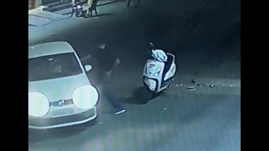 A CCTV grab of the incident where a man opened fire at his former friend outside a petrol pump in Ludhiana. (HT Photo)