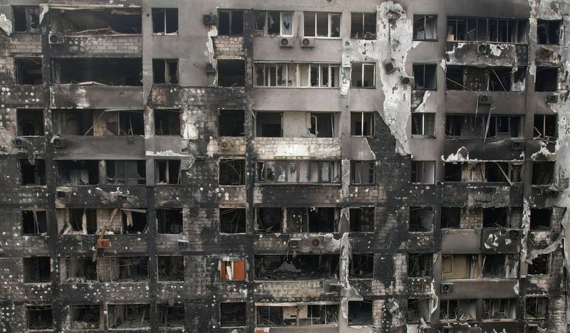 A view shows a residential building burnt during Ukraine-Russia conflict in the southern port city of Mariupol on Sunday. (REUTERS)