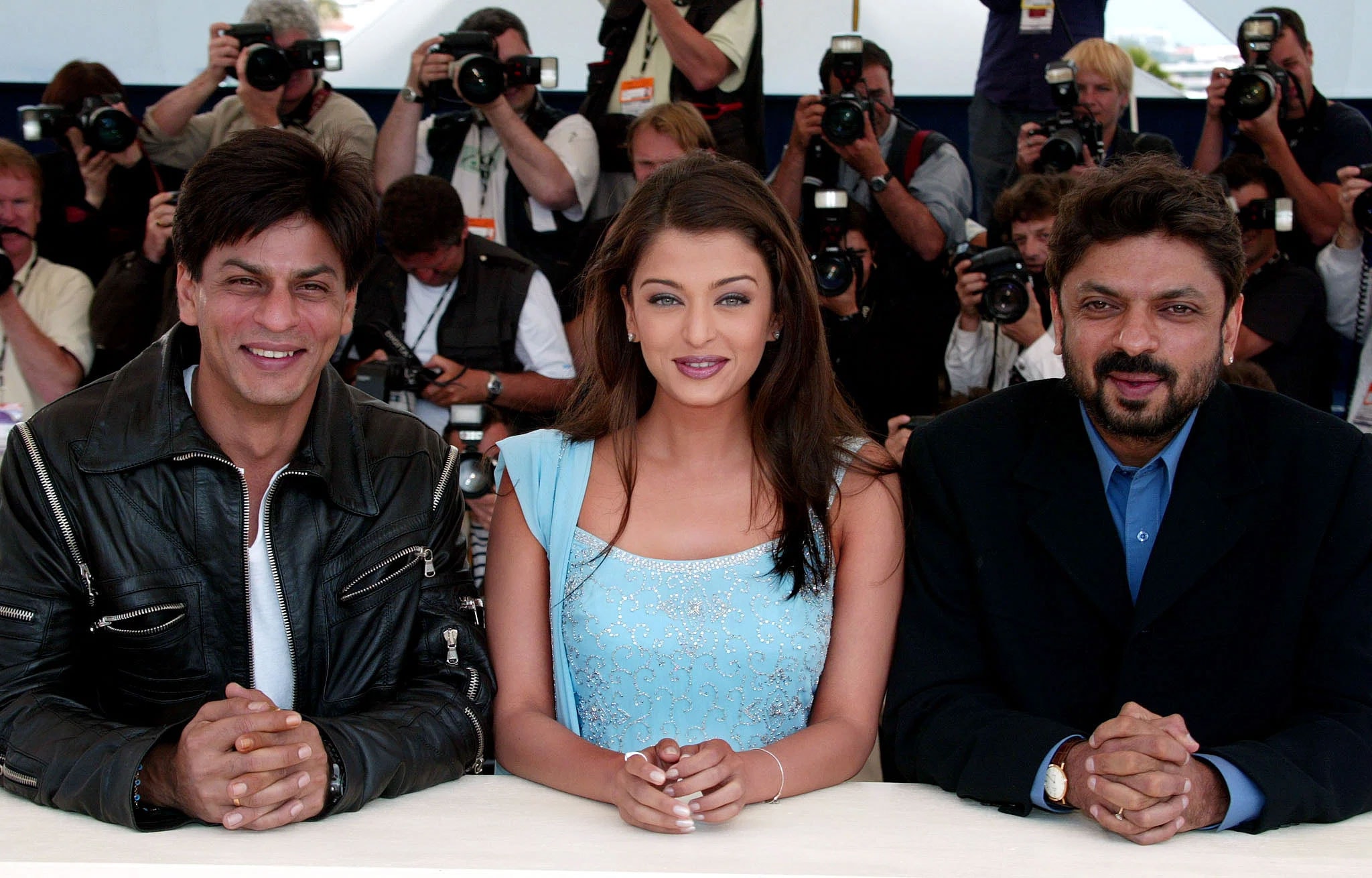 Actors Shah Rukh Khan and Aishwarya Rai with director Sanjay Leela Bhansali at Cannes Film Festival in 2002. (File Photo/Reuters)