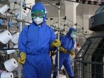 Employees of Songyo Knitwear Factory in Songyo district disinfect the work floor in Pyongyang, North Korea, Wednesday. Employees of Songyo Knitwear Factory in Songyo district disinfect the work floor in Pyongyang, North Korea, Wednesday.