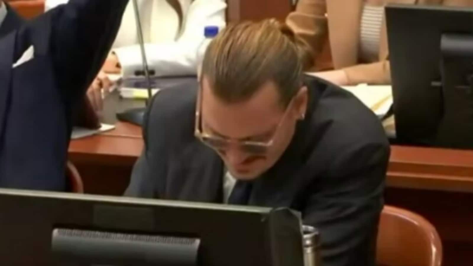 Johnny Depp smiles as Amber Heard’s lawyer imitates his voice amid trial