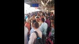 Commuters at Titwala railway station waiting for the general local train on Wednesday morning. (HT PHOTO)