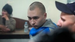 Russian Army Sergeant Vadim Shishimarin, 21, is seen behind glass during a court hearing in Kyiv, Ukraine.