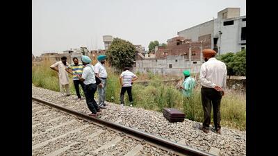 Officials investigating the spot where the body was found in Ludhiana on Wednesday. (HT Photo)