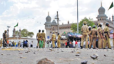 Policemen stand guard at the site of a blast in front of Mecca Masjid, the main mosque in the southern Indian city of Hyderabad. (REUTERS) Policemen stand guard at the site of a blast in front of Mecca Masjid, the main mosque in the southern Indian city of Hyderabad. (REUTERS)