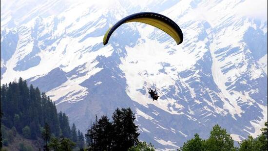 Manali, India - July 09: A tourist paragliding at Solang Nala near Manali in Himachal Pradesh, India on Friday, July 09, 2021. (Photo By Aqil Khan /Hindustan Times)