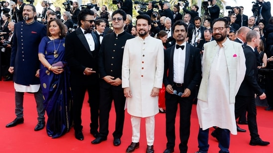 Ricky Kej, Vani Tripathi, R Madhavan, Prasoon Joshi, Anurag Thakur, Nawazuddin Siddiqui, and Shekhar Kapur pose at the opening ceremony of the 75th Cannes Film Festival. (Reuters)(REUTERS)