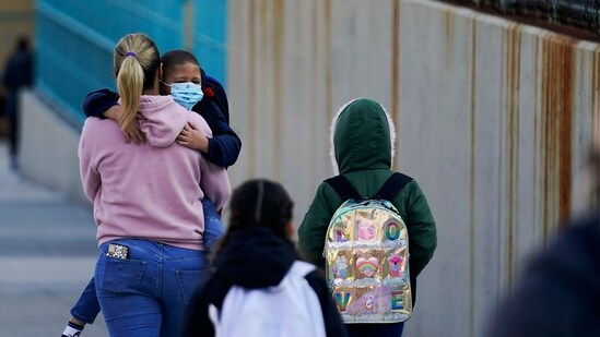 Children and their caregivers arrive for school in New York. (File image)(AP)