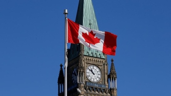 A Canadian flag flies in front of the Peace Tower on Parliament Hill in Ottawa, Ontario, Canada (REUTERS)