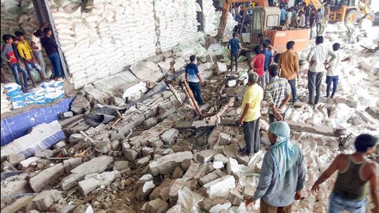 Rescue operation underway after a wall collapsed at a factory in Halvad GIDC area, in Morbi district of Gujarat on Wednesday. (PTI)