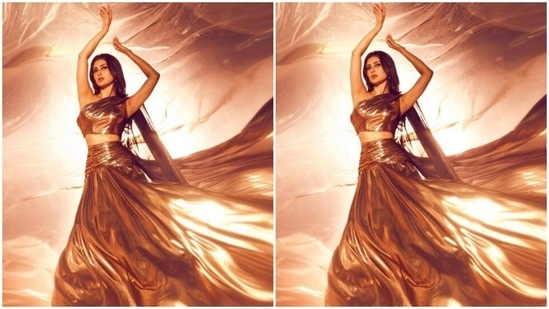 Mouni was caught in the middle of a pose with her arms upwards and looking away from the camera.(Instagram/@imouniroy)
