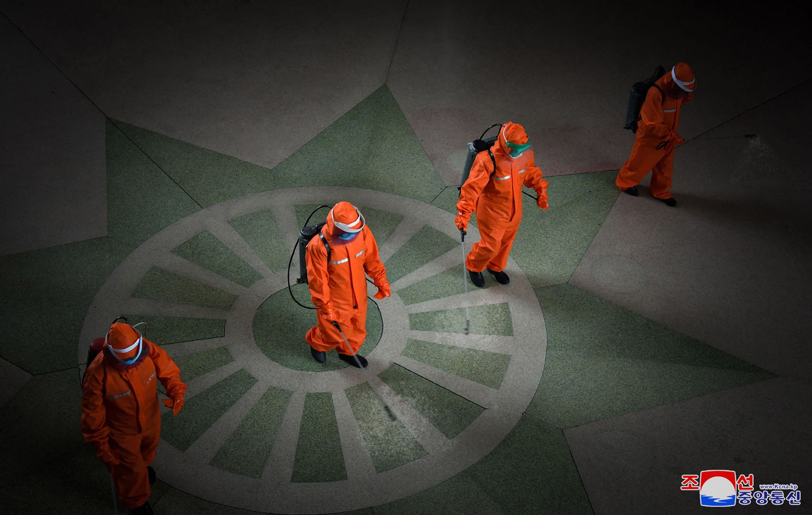 Railway station staff disinfecting Pyongyang station premises as a prevention measure against the Covid-19 coronavirus. (KCNA via KNS / AFP) Railway station staff disinfecting Pyongyang station premises as a prevention measure against the Covid-19 coronavirus. (KCNA via KNS / AFP)