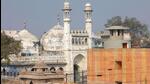 A worker stands on a temple rooftop adjacent to the Gyanvapi Mosque in the northern city of Varanasi, India, December 12, 2021. REUTERS/Pawan Kumar (REUTERS File Photo) A worker stands on a temple rooftop adjacent to the Gyanvapi Mosque in the northern city of Varanasi, India, December 12, 2021. REUTERS/Pawan Kumar (REUTERS File Photo)