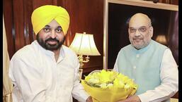 Union Home Minister Amit Shah being presented a bouquet by Punjab Chief Minister Bhagwant Mann during a meeting, in New Delhi (PTI)