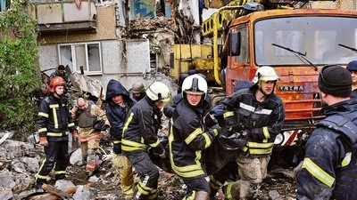 Rescuers carry the body of a civilian at a site of an apartment building destroyed by Russian shelling in Bakhmut, Donetsk region, Ukraine, on Wednesday. AP Rescuers carry the body of a civilian at a site of an apartment building destroyed by Russian shelling in Bakhmut, Donetsk region, Ukraine, on Wednesday. AP