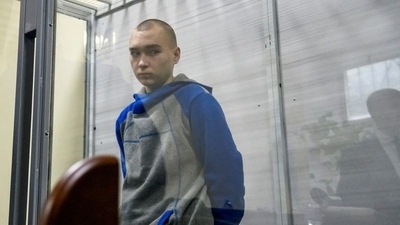 Russian soldier Vadim Shishimarin, 21, suspected of violations of the laws and norms of war, is seen inside a defendants' cage during a court hearing in Kyiv, Ukraine May 18, 2022. REUTERS/Vladyslav Musiienko (REUTERS)