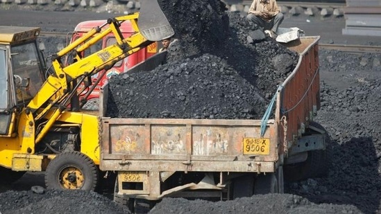 FILE PHOTO: A worker sits on a truck being loaded with coal at a railway coal yard on the outskirts of the western Indian city of Ahmedabad November 25, 2013. REUTERS/Amit Dave (REUTERS)